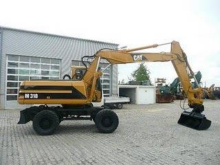 Excavator mobil pe roti CAT M 318 second hand de vanzare excavatoare 1998 8720h 28.900 Euro - Pret | Preturi Excavator mobil pe roti CAT M 318 second hand de vanzare excavatoare 1998 8720h 28.900 Euro